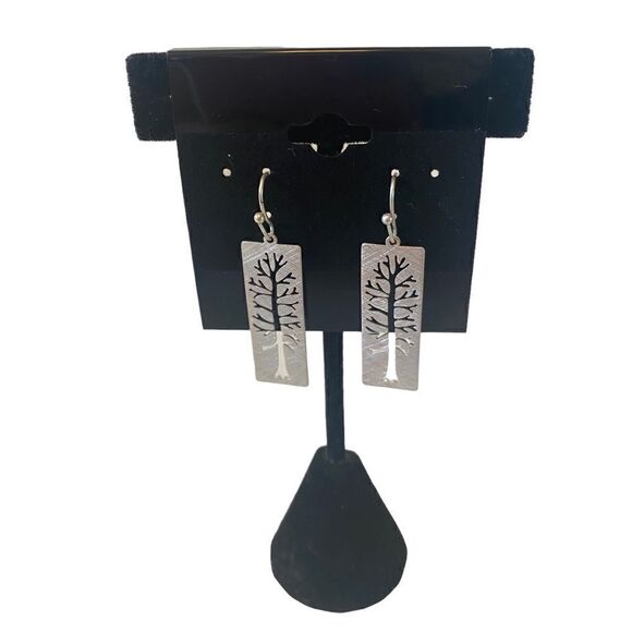 Simple beauty is defined in these Muted Silver Toned Rectangular Drop Earrings. - Picture 1 of 5